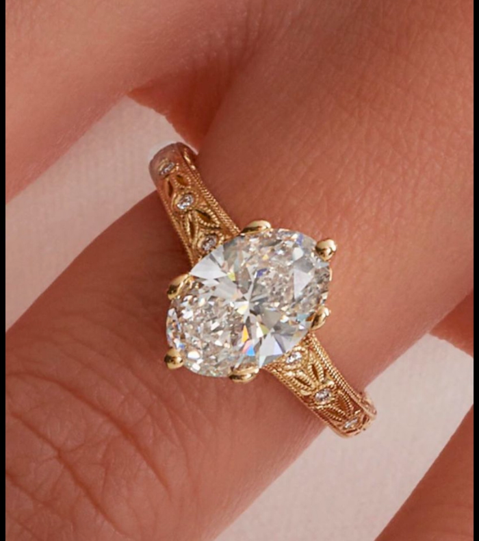 Custom Oval Solitaire Ring with Engraved and Diamond Studded Band